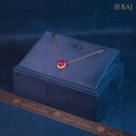 Scarlet Aura ruby and diamond pendant with chain in 18k gold featuring red gemstone center and diamond halo