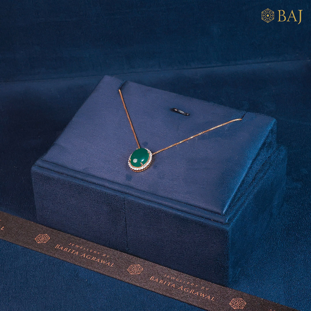 Emerald Radiance oval emerald and diamond pendant in 18k gold with halo diamonds on delicate chain