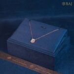 Halo Charm diamond pendant with chain in 18k gold featuring cushion shaped double halo diamond design