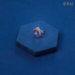 Bow design diamond ring in 18kt gold with elegant arc shaped bands
