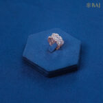 Heart shaped diamond ring in 18kt gold with halo diamond design