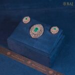 Emerald Royalty diamond necklace set with emerald center stone in 18k gold