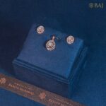 Orbit Shine circular diamond pendant set in 18k gold with matching earrings