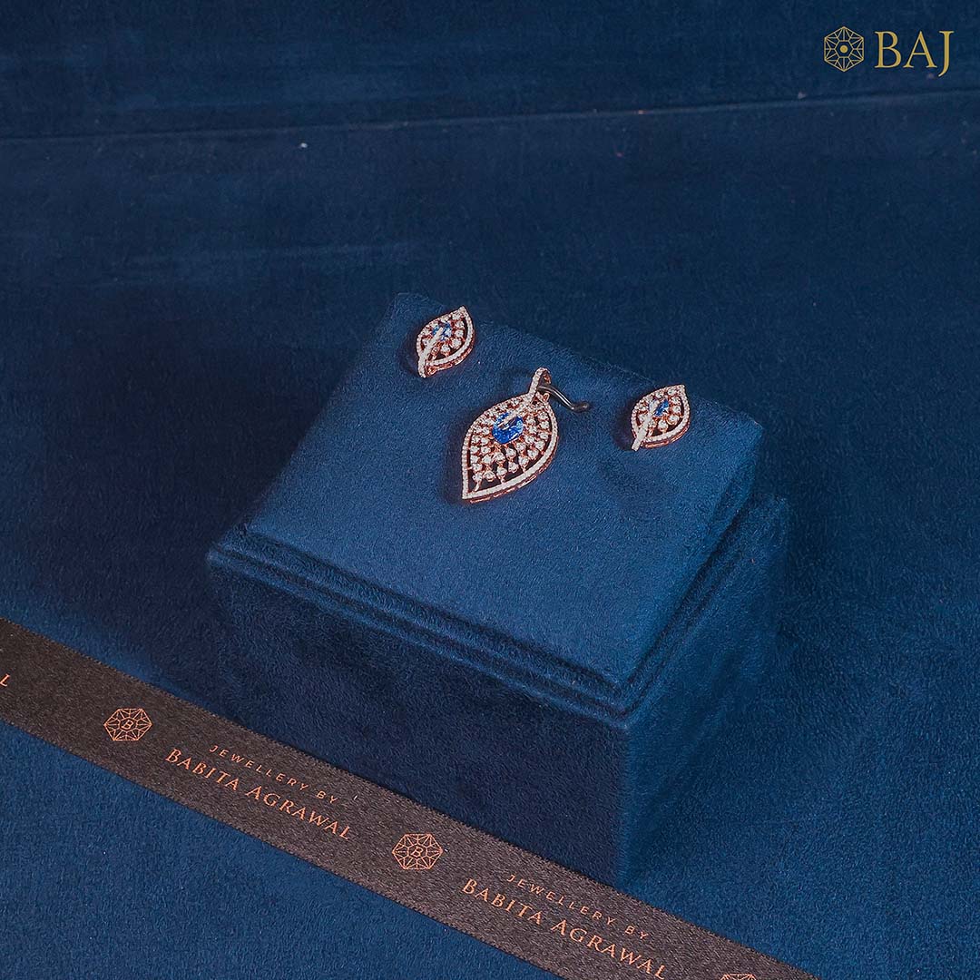 Leaf Luxe diamond pendant set in 18k gold with matching leaf design earrings