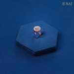 Spinny diamond ring in 18kt rose gold with floral halo design