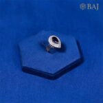 Blue Drop diamond ring with pear shaped blue gemstone in 18kt gold