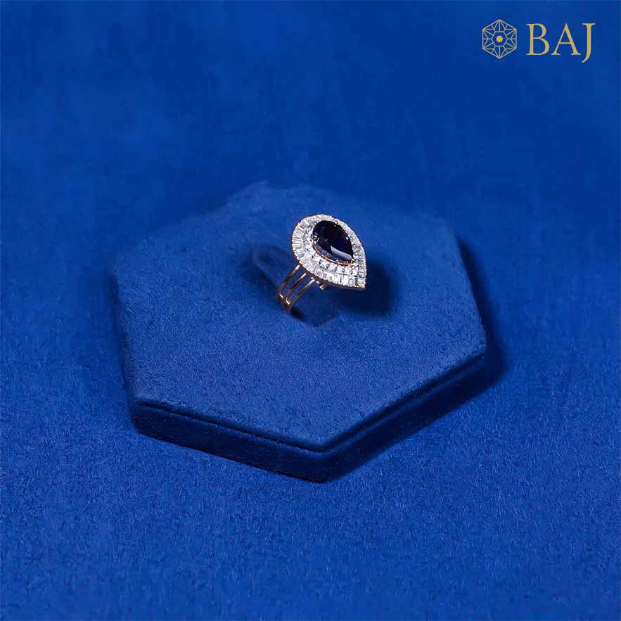 Blue Drop diamond ring with pear shaped blue gemstone in 18kt gold