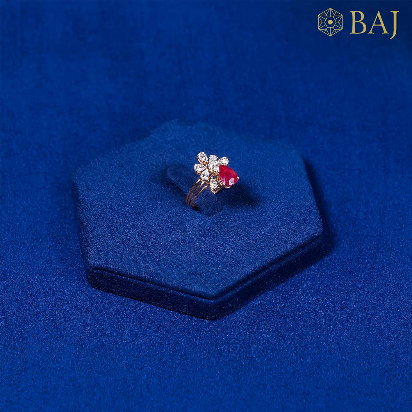 Red Corona diamond ring with red gemstone in 18kt gold