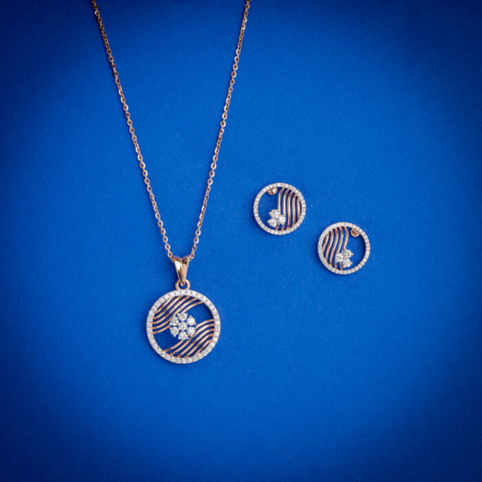 Diamond pendent set with circular striped design and matching earrings in 18k gold