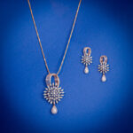 Diamond pendent set with floral diamond design and pearl drop earrings in 14k gold