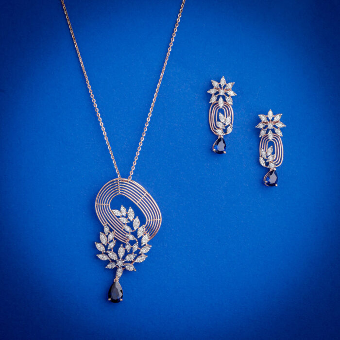 Luxury diamond pendant set with matching earrings and black drop stones in 14k gold