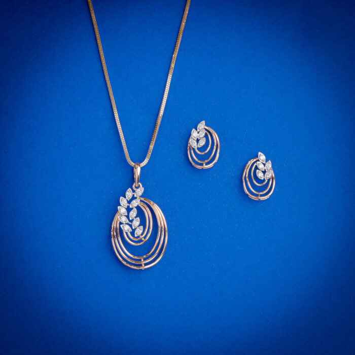 Elegant diamond pendent set with layered circular design and matching earrings in 18k gold