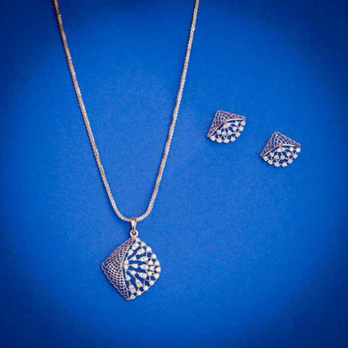 Diamond pendent set with lattice drop design and matching earrings in 14k gold